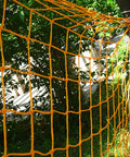 Outdoor Nylon Rope Hammock Swing With Mesh Seat hanging in vibrant orange among trees