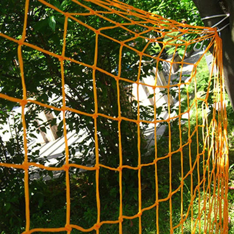 Outdoor Nylon Rope Hammock Swing With Mesh Seat hanging in vibrant orange among trees