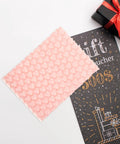 Cute Pink Heart Bubble Mailers 50 Pack Lightweight Cushioning Protective Envelopes for Jewelry and Small Gifts shown with gift card