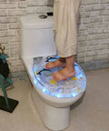 Child standing on Slick Transparent Dolphin Toilet Seat Featuring Smooth Glide Soft Close Lid Cover And Built In Led Night Light.