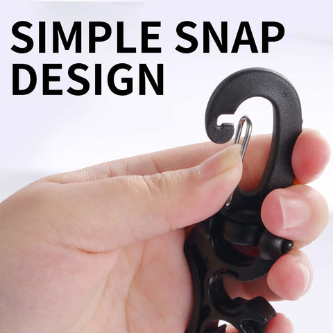 Close-up of hand using Two Pack Scuba Hose Clips For Dope Dive Gear, dual hose holder snap mechanism, black hook detail.