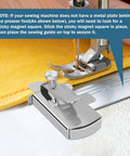 Front view of a chrome TIGARI magnetic seam guide with clamp on a sewing machine bed.
