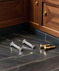 Rock Solid 100 Piece Pack M6 Cabinet Panel Binding Bolts for Furniture Assembly Made From Cold Rolled Steel on a floor.
