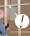 YY-LC flexible drill bit for wire pulling with wooden guide ball; front view of user using it to pull wires through walls