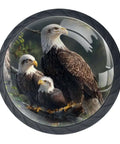 Three bald eagles perched on a branch with a detailed background, featured on a circular surface.