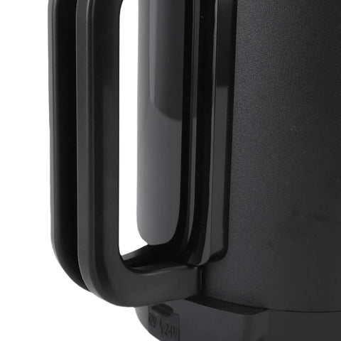 Close-up of Road Ready Car Electric Kettle forged from 304 stainless steel showing foldable handle for truckers brewing coffee.