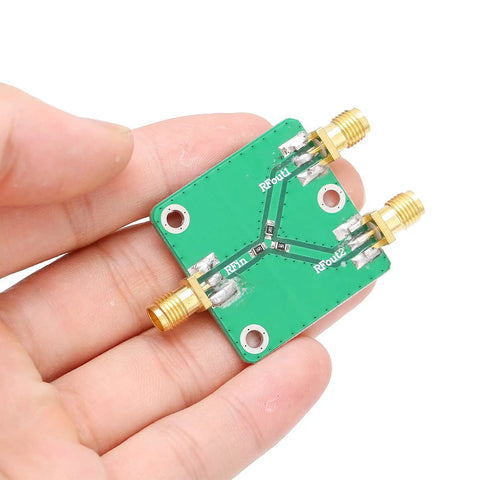 Built To Last Two Way RF Power Splitter PCB Board DC To Five Gigahertz Frequency Range With Six Decibel Attenuation held in hand.
