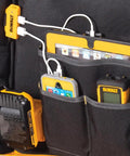 USB Charging Tool Backpack With Dual USB Ports 200 Lumen LED Light 20V Max Lithium Ion Battery Powered 23 Pocket Organizer For Contractors And DIY Pros On The Job showing internal pockets and charging devices