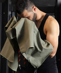 Man using Ultra Compact Microfiber Towel For Travel, Gym, And Camping, Fast Dry, Super Absorbent, Lightweight