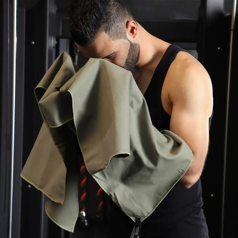 Man using Ultra Compact Microfiber Towel For Travel, Gym, And Camping, Fast Dry, Super Absorbent, Lightweight