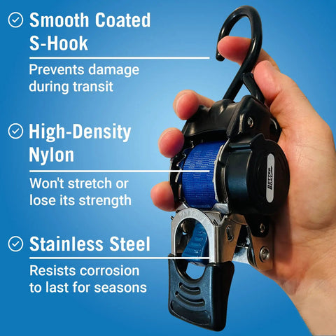 Hand holding heavy duty stainless steel retractable ratchet strap set 1 inch by 72 inch with auto self retracting buckle.