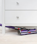 Cyclone V10 Animal Cordless Vacuum Cleaner With Quick Release Extension Hose cleaning under white dresser