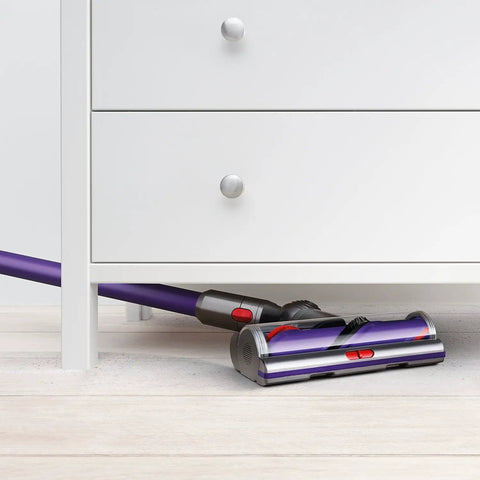 Cyclone V10 Animal Cordless Vacuum Cleaner With Quick Release Extension Hose cleaning under white dresser