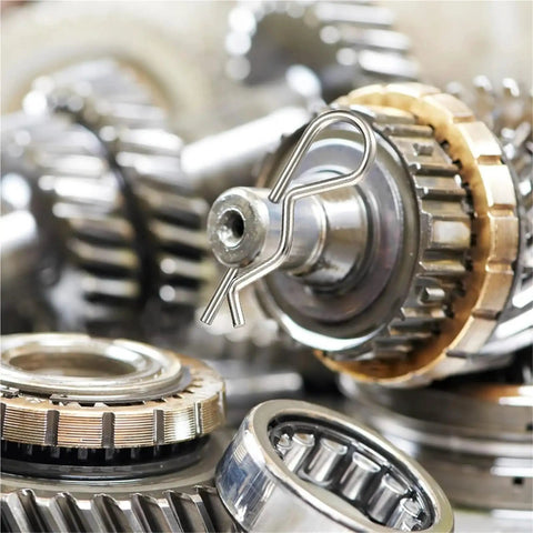 Close-up of R Clip Cotter Pins Set, Stainless Steel Assortment Kit With 200 300 And 500 Piece Packs on mechanical gear
