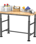 Adjustable Height Workbench for Garage and Workshop with 0.8 Inch Solid Rubberwood Top, Heavy Duty Build shown with tools and supplies