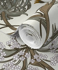 Close-up of Straight Up Stunning Jumbo Floral Neutral Wallpaper With Matte Linen Texture, rolled and ready for installation.