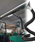 Heavy Duty Stainless Steel Fume Capture Arm With Smooth Rolling Suction Hose on worksite for fast smoke extraction.