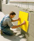 Installer using Eight Piece Concrete Stamping Mats Set With Reusable Polyurethane Texture Mats for stamping concrete wall.