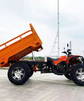 Heavy Duty Utility Trailer With Bucket For Tractor And ATV Use, parked on concrete with raised orange bucket, side view.
