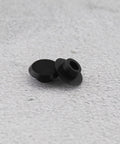 50 Pack Socket Head Screw Cover Caps For M6 Allen Screws, Black Hex Head Plastic Protectors on gray surface