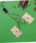 Hands On Circuit Board Kit For Young Experimenters Electrical Circuit Building Set components on green background