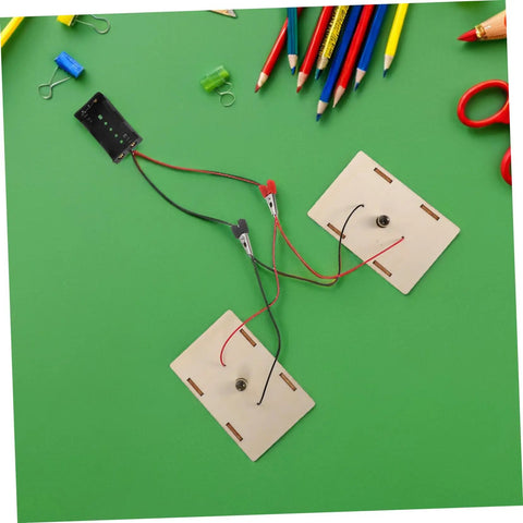 Hands On Circuit Board Kit For Young Experimenters Electrical Circuit Building Set components on green background