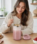 Woman enjoying soup from a Big 27oz Wide Mouth Food Jar Made From Stainless Steel Keeps Your Grub Hot For Ten Hours Straight Up Leak Proof Performance Locks In Chill Till Midnight Perfect For Grab And Go Work Or School Vibes Pink.