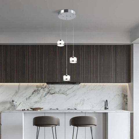 Led Dimmable Three Light Pendant Fixture With Dope Chrome Finish hanging in modern kitchen with marble backsplash