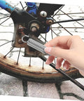 Eight Pieces Extended Compression Spring Assortment Kit For Electric Vehicle Stands Ladder Foot Supports With Heavy Duty Stainless Steel Build For Reliable Structure And Smooth Easy Use In Garage Or Home Projects, stainless steel coil spring held near bicycle wheel