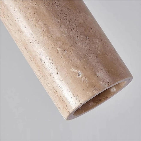 Close-up of the Yellow Travertine Pendant Light In Nordic Wabi Sabi Style, showing natural stone texture and cylindrical shape