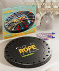 Rope Untangling Puzzle Game For Kids And Adults, Educational Strategy Board Game box and components displayed on a table.