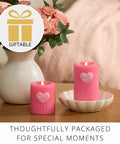 Flickering Flameless Pillar Candle 3.7x4.5 Inches With Real Flame Effect Pink Ribbed Wax Embossed Heart LED Light on table