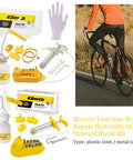 All In One Bike Hydraulic Disc Brake Bleed Kit with 12 oil filling joints and funnels shown with cyclist on road bike.