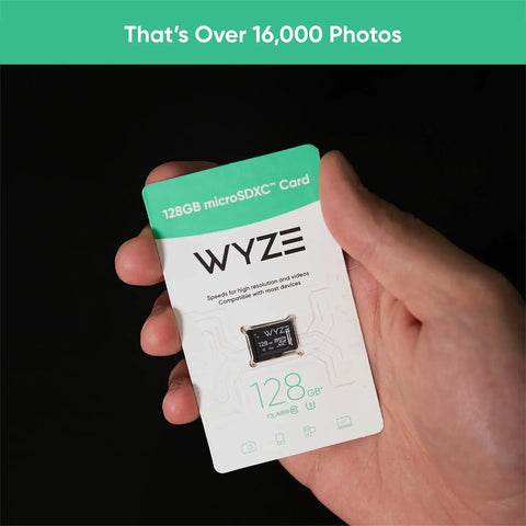 Hand holding a 128GB MicroSDXC Card Class 10 U3 Expandable Storage for Security Cameras and Dash Cams with packaging