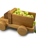 Top Notch Food Safe Hard Wax Oil For Kitchen Countertops And Interior Woodwork Solvent Free Water Repellent Wood Finish Sealant in a wooden toy truck holding brussels sprouts.