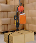 Beefy Electric Chain Hoist Winch With Wireless Remote G80 Steel Chain Double Overhead Crane System 2200 Lbs lifting packages in a warehouse.