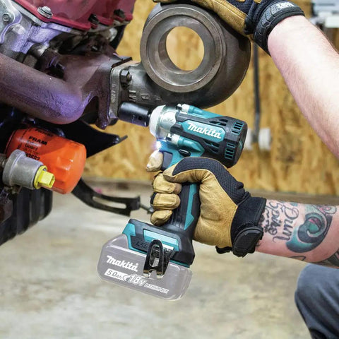 18V LXT Brushless Cordless Three Eighths Inch Drive Impact Wrench With Friction Ring Anvil in use on vehicle part