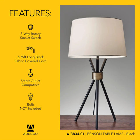 Benson Tripod Floor Lamp, 60 Inch Tall, Black With Antique Brass Accent, Drum Linen Shade, front view on table
