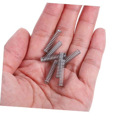 Premium 100Pcs Stainless Steel Compression Springs Assortment Kit For Versatile Diy Repairs, Auto And Car Fix-Ups, Heavy Duty Mini Mechanical Springs To Save Time And Cash. Small stainless steel compression springs in a hand