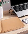 Kraft Mailing Envelopes 10 Pack With Double Sided Adhesive Seal Self Sealing Shipping Bags on desk near laptop, 238x335x40mm
