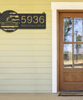 Personalized Farm Themed Metal Address Sign With US Flag Design And LED Lights Outdoor House Number Plaque Waterproof Wall Decor For Home Or Farm 6 Inch mounted beside a wooden door.