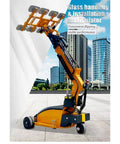 Pro Grade Glass Vacuum Lifter With Wireless Remote Control Delivers No Sweat Heavy Lifting For Window And Curtain Wall Installations, showcasing yellow glass manipulator on a job site.