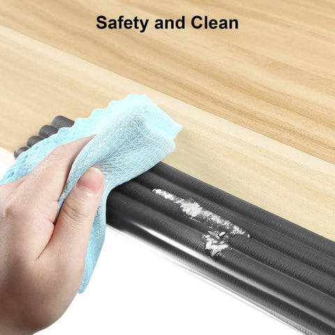 Female hand cleaning Tot Safe Edge Corner Protectors 16 Foot Ultra Plush Foam Bumpers With Rock Solid Adhesive for sharp tables.