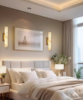 Brushed Brass And Natural Alabaster Wall Sconces Set Of Two above a bed creating a chill ambient glow in a modern bedroom.