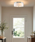 Walker 20 Inch Dope Mid Century Modern 3 Light Flush Mount Ceiling Light With White Linen Fabric Drum Shade installed in hallway