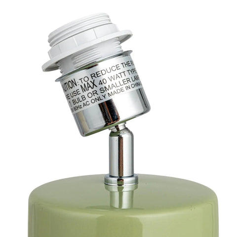 Close-up of bulb socket on stoneware table lamp in celery green with linen drum shade modern boho style lighting for living room.