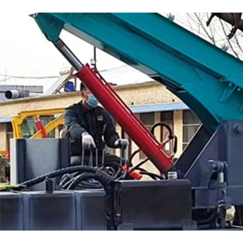 Operator on Beefy Hydraulic Guardrail Pile Driver Machine for Post Installation and Highway Roadside Guardrail Construction