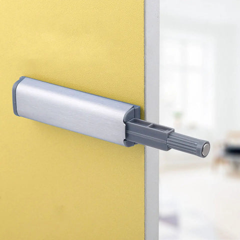 Push To Open Cabinet Latch Kit For Doors And Drawers Hidden Door Catch Hardware installed on yellow cabinet door