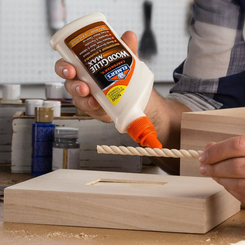Carpenter Wood Glue Max Tough As Nails Extra-Strength Interior And Exterior Adhesive 16 Oz in use on wood project.