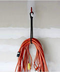 32 Inch Heavy Duty Bungee Cords With Hooks 8mm Elastic Rope securing an orange cable on a wall hook, UV resistant stretch rope